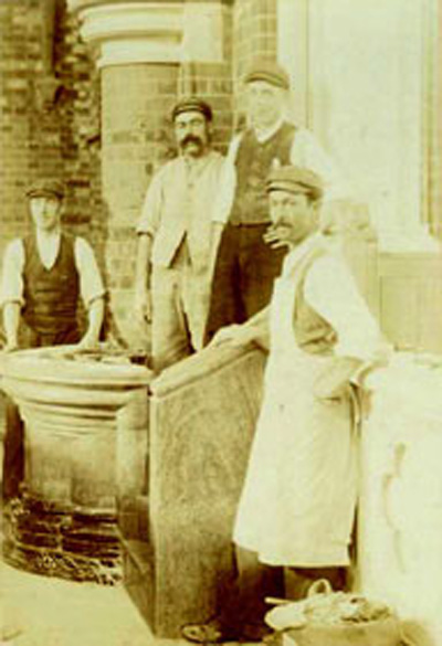 Workmen building the marble pulpit in 1904 